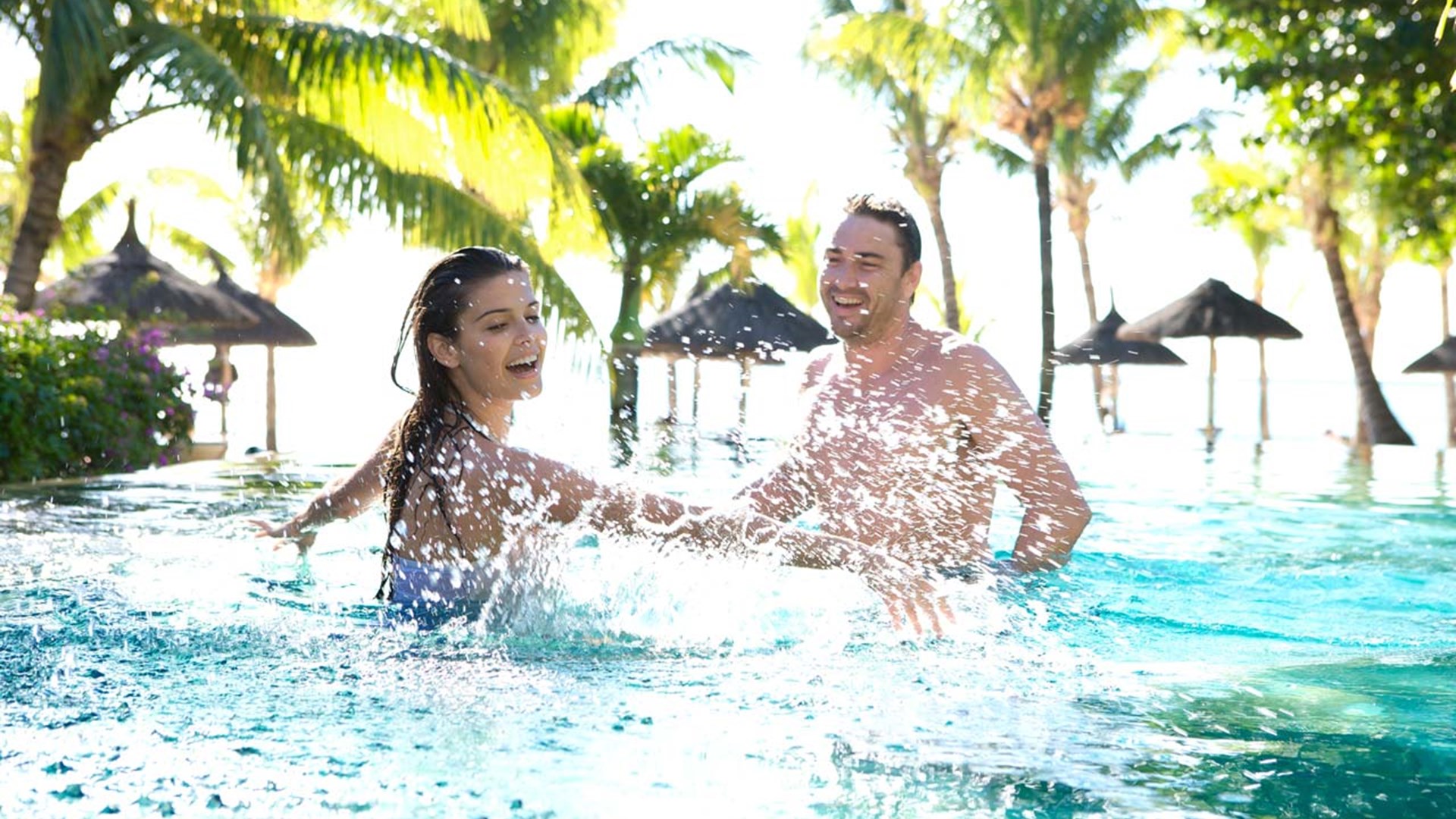 Couple in Oasis pool at LUX* Le Morne